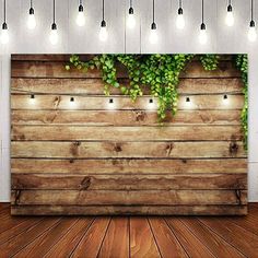 an image of a wooden wall with vines on it and lights hanging from the ceiling