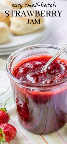 strawberry jam in a glass jar with strawberries on the side and text overlay that reads easy small batch strawberry jam