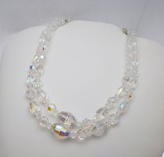 "This is a very elegant and classic double strand necklace. The necklace has oval, round and bicone shaped crystal beads with Aurora Borealis effect on them. The strand is 14\" long with a 3\" extension piece on the back. The strands are slightly different lengths so that they lay nicely on the neck. Strand is in great shape with minimal wear to the beads. *We are always willing to ship Internationally! Please message us for a quote" Crystal Goddess, Beading Jewelery, Aurora Borealis Crystal, Double Strand Necklace, Vintage Necklaces, Chunky Jewelry, Pin Pendant, Eternity Band Diamond, Necklace Vintage