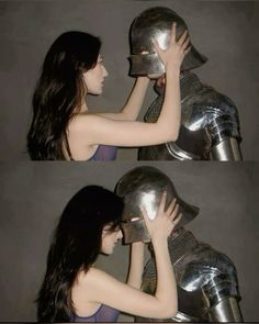 the woman is touching the helmet on the man's head