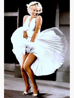 marilyn monroe dancing on the street in white dress with her legs spread out and smiling