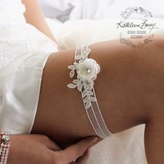 Off white stretch wedding garter with ivory corded bridal lace and handmade 3D flower detailing. I can adapt the focal flower to any color required please leave me a note on check out if you select custom variation. (sold individually tossing garter available at this link https://www.etsy.com/listing/855492792/bridal-tossing-garter-simple-garter-with?ref=shop_home_active_1&frs=1) Standard size is 380mm (un-stretched) and fits most people, if you require a particular size please also leave me Adjustable White Bridal Belt For Bridesmaid, White Adjustable Bridal Accessories For Bridesmaids, Adjustable Handmade Flowers Bridal Accessories, Wedding Garder, Bride Garter, Bridal Hangers, Wedding Garter Lace, Wedding Garters, Leg Bands