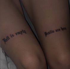 two people with tattoos on their legs that say, hell is simply genius are here