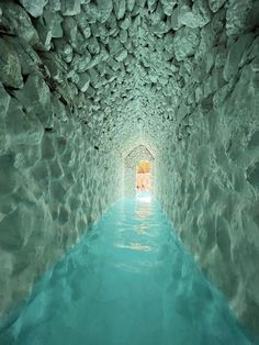 the water is blue and clear in this tunnel