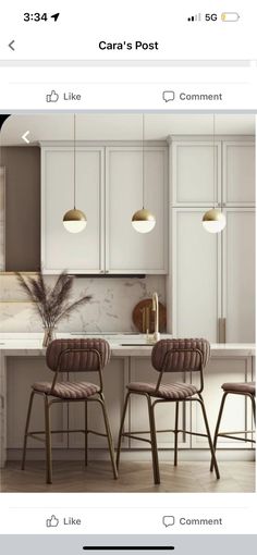 three chairs are in the middle of a kitchen with marble counter tops and white cabinets