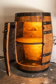 an old wooden barrel is turned into a shelf