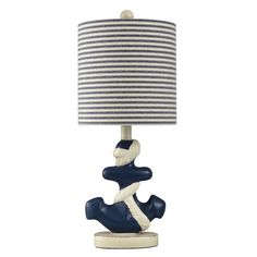 a blue and white lamp with a striped shade