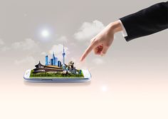 a hand pointing at a model of a city on top of a cell phone screen