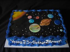 a birthday cake with an image of the solar system on it