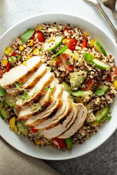 a white plate topped with meat and veggies