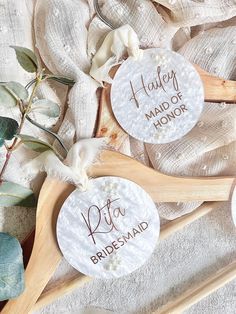 three personalized wooden spoons sitting next to each other on top of a table