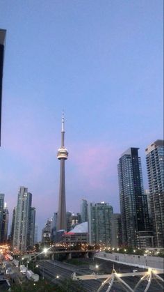 the city skyline is lit up at night