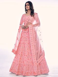 Buy radiant pink net embroidered lehenga choli for celebrating upcoming festival celebration. Shop this classy lehenga choli which comes with Net blouse and Net dupatta.