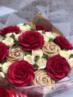 a bouquet of red and white roses on instagram