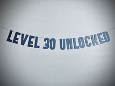 a banner that reads level 30 unlocked hanging from a string