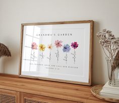 an arrangement of flowers in vases on top of a dresser