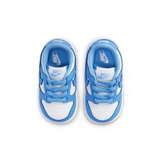 Best gifts for newborns/babies! Step into a piece of history with the Nike Dunk Low Retro University Blue TD. This iconic silhouette isBased on the original "Be True to Your School" series from 1985, and features classic color blocking in a crisp white and pale blue. The no-tie elastic laces secure a durable leather upper, while the padded mesh collar and breathable nylon tongue provide step-in comfort. The rubber outsole features a concentric-circle traction pattern for reliable grip, making this sneaker perfect for everything from casual wear to skateboarding. Unc University, Adidas Shoes Yeezy, Gifts For Newborns, School Series, Baby Boy Summer, Nike Models, Summer Sneakers, Baby Boy Shoes