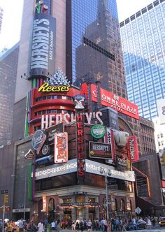 a large building with many signs on it's sides