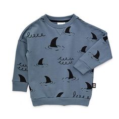 This modern Little Man Happy Sharks Sweatshirt is soft, warm, and playful. Gender-neutral, this kids' sweatshirt is casual and perfect for everyday wear. Shop the look at Little Nomad!Ocean themed kids clothing, under the sea