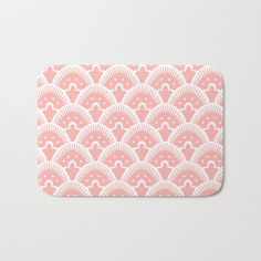 pink and white fan pattern bath mat