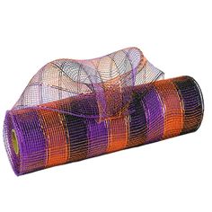 a roll of purple and orange mesh on top of a white surface with a ribbon around it