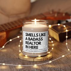 "Looking for the best realtor gift for your real estate agent? This Smells Like A Badass Realtor candle is for you!  Perfect for both men and women that work as a realtor selling homes! Makes a great birthday, Christmas, Valentine's Day, thank you gift, appreciation gift, graduation gift, Mother's Day, or Father's Day gift for anyone who works as a realtor. Packed with immersive aromas, these scented candles come in 9oz glass jars and are one size (2.8″ × 3.5\") (7.1cm × 8.8cm).  Made with 100% natural soy wax blend, each candle features a 100% cotton wick and a permanent adhesive label. .: Materials: 100% natural soy wax blend, 100% cotton wick and a glass jar .: One size: 2.8″ × 3.5\" (7.1cm × 8.9cm) .: Burning time: 50-60 hours .: Glossy permanent adhesive label .: Choose from five diff Gifts For A Realtor, Realtor Valentines Day, Realtor Catch Phrases, Real Estate Tumbler, Gifts For Real Estate Agent, Real Estate Agent Gifts, Realtor Gifts From Buyer, Home Buyer Gifts From Realtor, Realtor Thank You Gift