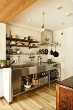 a kitchen filled with lots of pots and pans