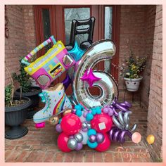 the number six is surrounded by balloons and shoes