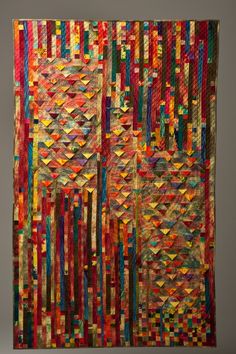 an art piece with many different colored strips on it