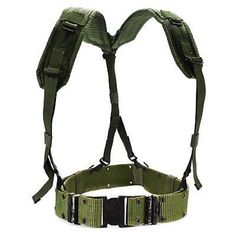 a green harness with two buckles on each side and one strap down to the chest