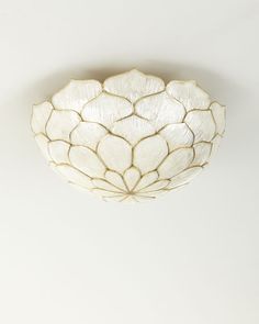 a white ceiling light hanging from the ceiling