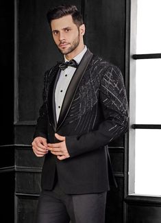 Presenting the Black Embroidery Tuxedo Set is a stunning embodiment of refined elegance, crafted from a premium poly-blend fabric that ensures comfort and durability. The black tuxedo jacket is adorned with intricate cutdana embroidery, it offers a sophisticated touch to its overall design. The expertly crafted embroidery on the jacket creates a striking visual contrast, making it a standout to any event. Teamed with matching black trousers, modern silhouette perfect for wedding receptions or co Cutdana Embroidery, Black Tuxedo Jacket, Dress Suits For Men, Vacuum Storage, Indian Wedding Wear, Black Embroidery, Black Tuxedo, Tuxedo For Men, Cocktail Parties