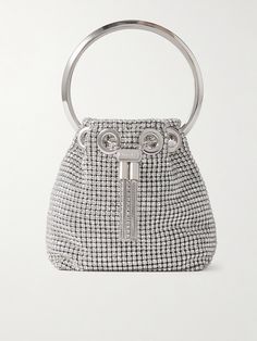 Jimmy Choo's 'Bon Bon' bag is a brand signature, defined by its petite bucket silhouette and structured bracelet handle. This version is updated in satin covered in light-catching crystals and has a drawstring closure and tasseled metal clasp. Drape the longer chain strap across the body when you want to go hands-free. Luxury Handheld Bucket Bag For Evening, Silver Bucket Bag For Formal Occasions, Elegant Silver Bucket Bag For Evening, Luxury Silver Bucket Bag For Party, Luxury Handheld Bucket Bag For Party, Designer Silver Evening Bag With Top Handle, Luxury Silver Bucket Bag For Evening, Elegant Bucket Bag With Handle Drop For Evening, Elegant Evening Bucket Bag With Handle Drop