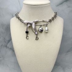 100% Authentic, Upcycled Dior Silver Paper Clip Charms & Pearl Drop On A Necklace. Repurposed By Hand Into A 15” Barbed Wire Chain Choker Necklace Made Of Premium Stainless Steel (Friendly For Sensitive Skin) With A Lobster Clasp Closure. Check Out Www.Luxenouvelle.Myshopify.Com For More Styles + Free Shipping Wire Choker Necklace, Wire Choker, Silver Paper, Dior Jewelry, Barbed Wire, Chain Choker Necklace, Chain Choker, Pearl Drop, Paper Clip