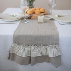 a table topped with plates and glasses filled with food