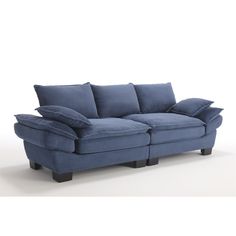 a blue couch sitting on top of a white floor