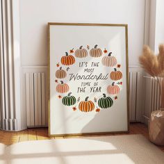 there is a framed poster with pumpkins on it