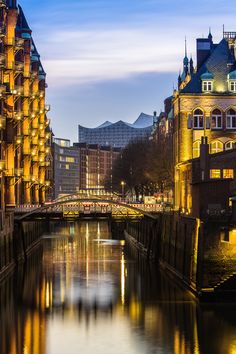 a river running through a city next to tall buildings