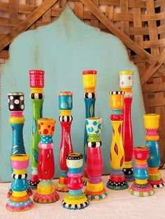 a group of colorful candles sitting on top of a table