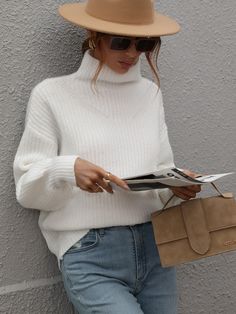 Our Chester Knit is a beautiful cotton white tone with turtleneck that is most definitely an essential this A/W. The wool blend fabric is perfect for keeping you cosy during the cooler months, whilst the statement cuff on the sleeve and the knit speckled detailing throughout the fabric create a perfect, go-to classic staple. Pair it with your favourite ankle boots or ugg as a comfy A/W go-to look! Size Guide: Ambre is 5’2” tall, and has a 33.2” bust, 24.5”waist, & 36.7” hips. She is wearing a S White Oversized Turtleneck Outfit, Highnecksweater Outfits Women, White Pullover Outfit Winter, White Turtleneck Outfit Women, White Turtleneck Outfit Winter, White Pullover Outfit, White Turtleneck Sweater Outfit, Astronaut Oc, White Jumper Outfit