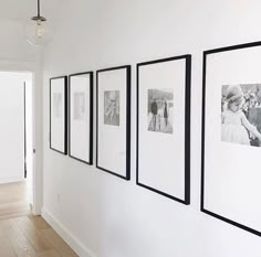 four black and white photographs hanging on the wall