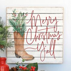 a christmas sign with boots and pine cones