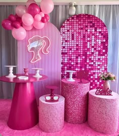 a pink party with balloons and decorations on the walls, tables and stools for children's birthday