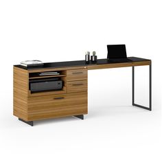 an office desk with drawers and a laptop on top