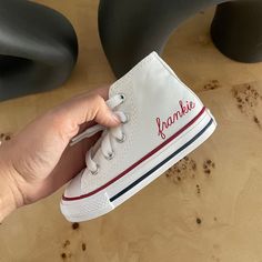 These are the coolest sneakers ever and make the best gift. They come with a beautiful subtle monogram or name printed on the side of the left shoe in a deep red on the white converse and white on the navy converse. I do have quite a few sizes available in stock, so if you're in a rush let me know and I can tell you if shipping/processing time will be even faster than listed.  Incredible birthday, Christmas, new baby gift. White High-top Sneakers With Embroidered Logo, Customizable Lace-up Sneakers For Gift, White Custom Sneakers With Embroidered Logo, White Custom Lace-up Sneakers With Embroidered Logo, Custom White Lace-up Sneakers With Embroidered Logo, White High-top Sneakers For Birthday, White Letter Print Lace-up Sneakers, Customizable Red Sneakers, Customizable Red Sneakers With Round Toe