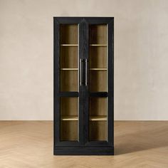 an empty bookcase with glass doors on the front and back sides, in a room