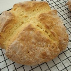 two loaves of bread sitting on top of a cooling rack