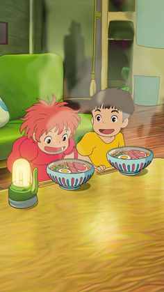 two children sitting at a table with bowls of food in front of them and a green couch behind them