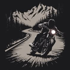 a motorcyclist rides down a winding road with mountains in the back ground