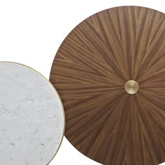 two circular tables with marble tops, one in white and the other in brown wood